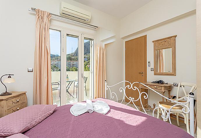 Double bedroom with A/C and balcony access . - Villa Fedra . (Photo Gallery) }}