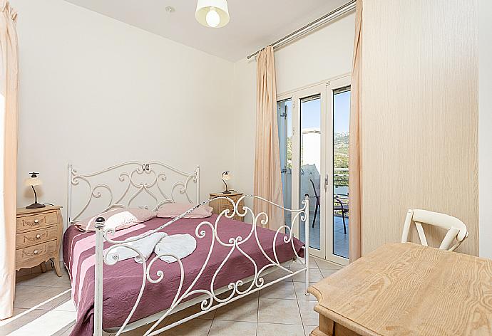 Double bedroom with A/C and balcony access . - Villa Semeli . (Photo Gallery) }}