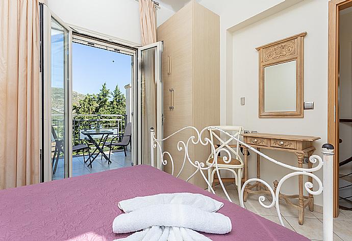 Double bedroom with A/C and balcony access . - Villa Semeli . (Photo Gallery) }}