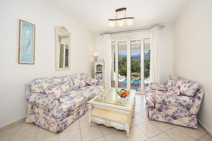 Living area with sofas, WiFi internet, and A/C . - Villa Semeli . (Photo Gallery) }}