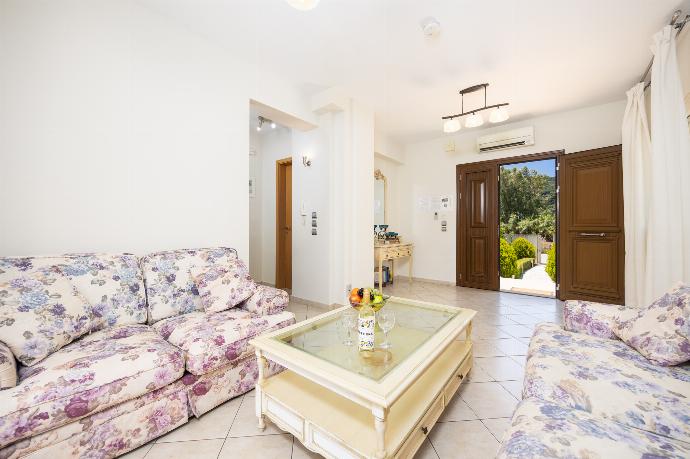 Living area with sofas, WiFi internet, and A/C . - Villa Semeli . (Photo Gallery) }}