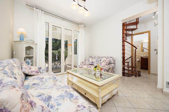 Living area with sofas, WiFi internet, and A/C . - Villa Semeli . (Photo Gallery) }}