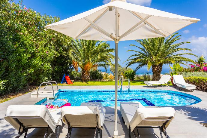 Private pool, terrace, and garden with sea views . - Villa Sevos . (Галерея фотографий) }}
