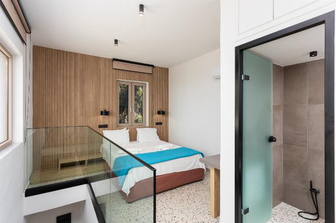 Double bedroom with en suite bathroom, A/C, and sea views . - Villa Sevos . (Photo Gallery) }}