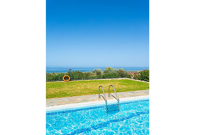 Private pool, terrace, and garden with panoramic sea views . - Villa Garifallia . (Photo Gallery) }}