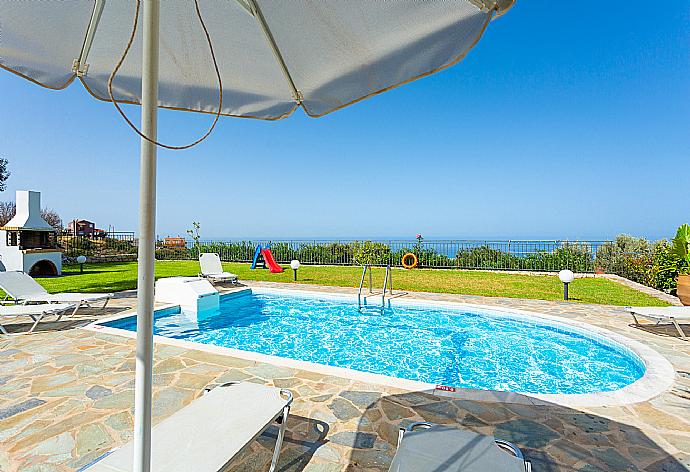 Private pool, terrace, and garden with panoramic sea views . - Villa Garifallia . (Galería de imágenes) }}