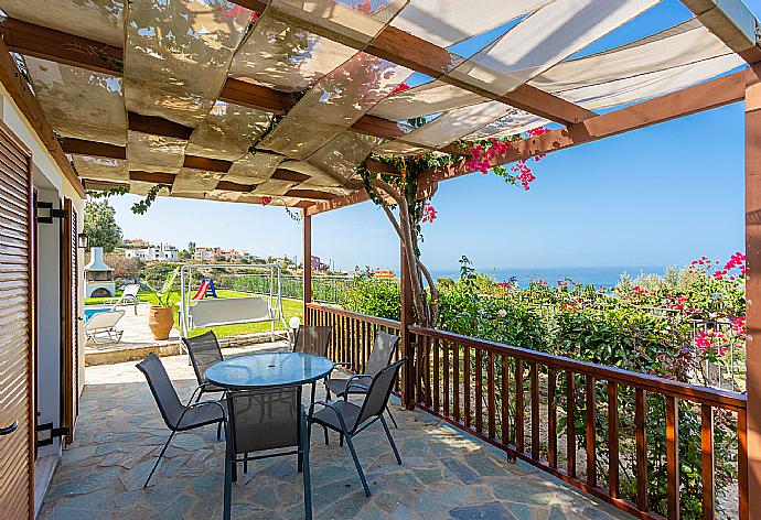 Sheltered terrace area with panoramic sea views . - Villa Garifallia . (Photo Gallery) }}