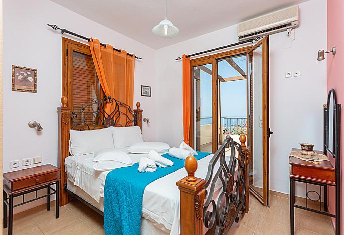 Double bedroom with A/C and balcony access . - Villa Garifallia . (Photo Gallery) }}