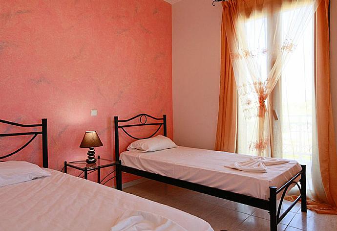 Twin bedroom with A/C . - Villa Nisyros . (Photo Gallery) }}