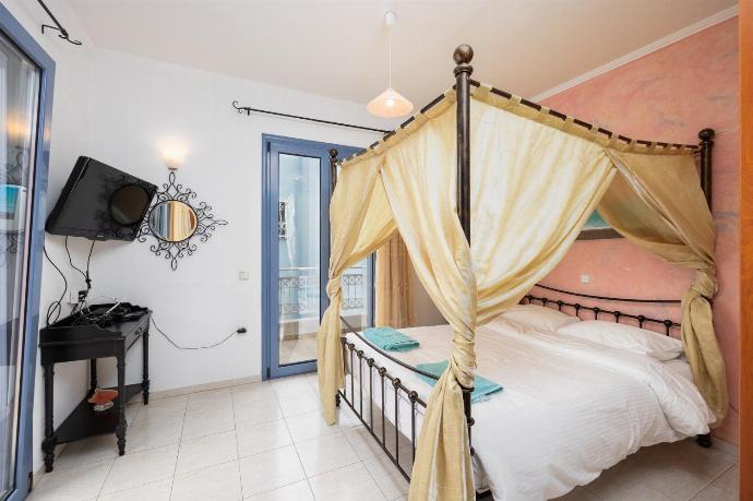 Double bedroom with A/C and TV . - Villa Nisyros . (Photo Gallery) }}
