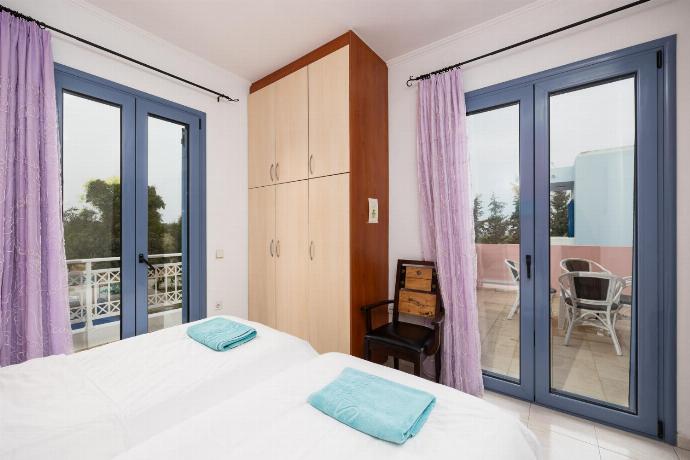 Twin bedroom with A/C . - Villa Nisyros . (Photo Gallery) }}