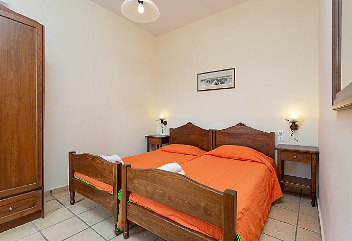 Twin bedroom with A/C and balcony access . - Villa Kefalas . (Photo Gallery) }}