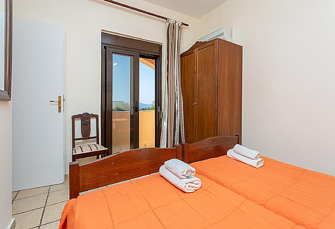 Twin bedroom with A/C and balcony access . - Villa Kefalas . (Photo Gallery) }}