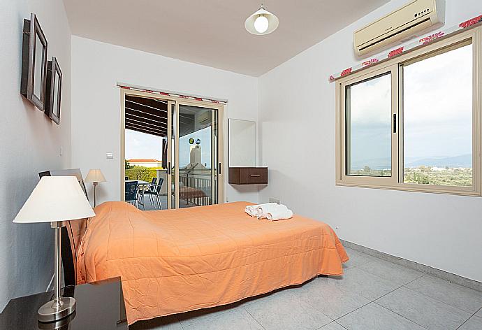 Double bedroom with A/C and terrace access . - Villa Prodromos . (Photo Gallery) }}