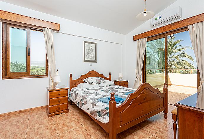 Double bedroom with en suite bathroom, A/C, and upper terrace access . - Villa Noni . (Photo Gallery) }}