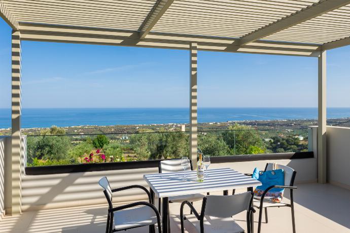 Upper terrace area with sea views . - Villa Michalis . (Photo Gallery) }}