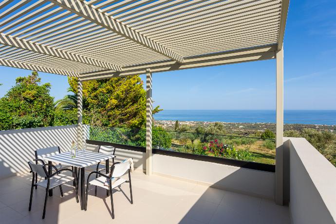 Upper terrace area with sea views . - Villa Michalis . (Photo Gallery) }}