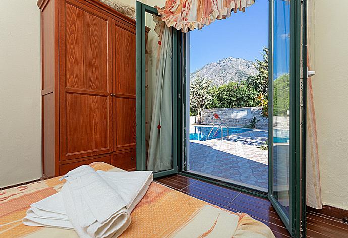 Twin bedroom with A/C and pool terrace access . - Villa Dimitrios . (Photo Gallery) }}