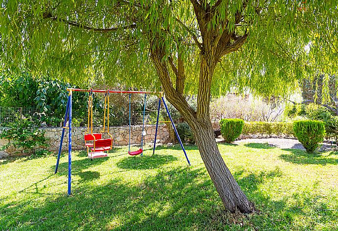 Garden area with swings . - Villa Georgia . (Photo Gallery) }}