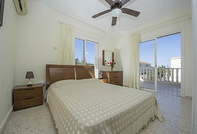 Double bedroom with A/C and balcony access . - Villa Prodromi . (Photo Gallery) }}