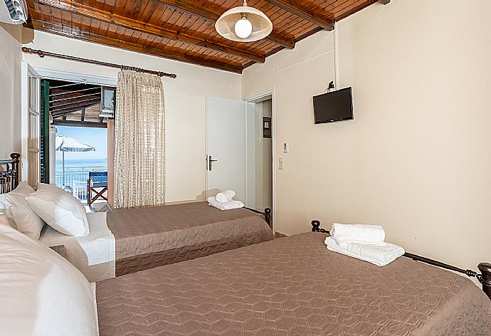 Twin bedroom with A/C and sea views . - Villa Elia . (Photo Gallery) }}