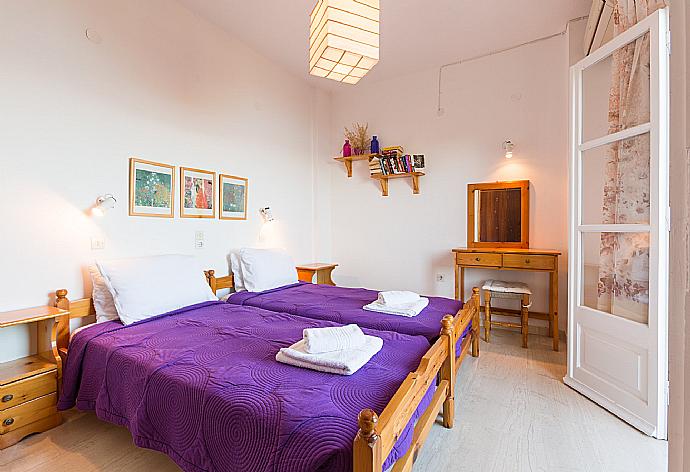 Single bedroom with A/C and balcony access . - Nikolas Apartment Alpha . (Photo Gallery) }}