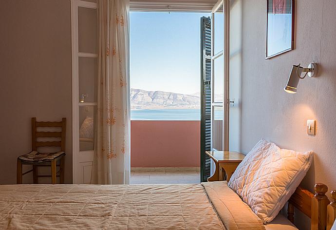 Single bedroom with A/C and balcony access . - Nikolas Apartment Alpha . (Photo Gallery) }}