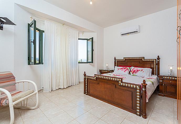 Double bedroom with en suite bathroom, A/C, and upper terrace access . - Villa Olivetta . (Photo Gallery) }}