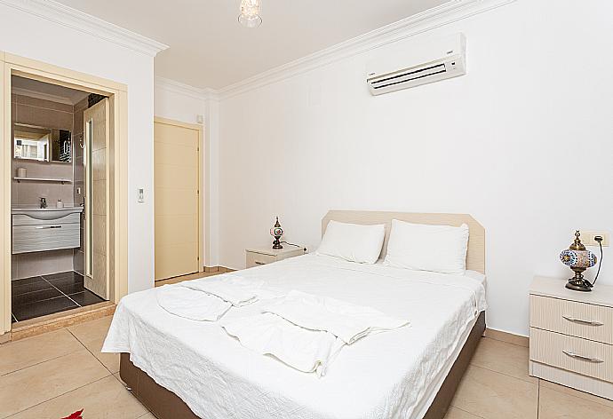 Double bedroom with en suite bathroom, A/C, and balcony access . - Villa Canberk . (Галерея фотографий) }}