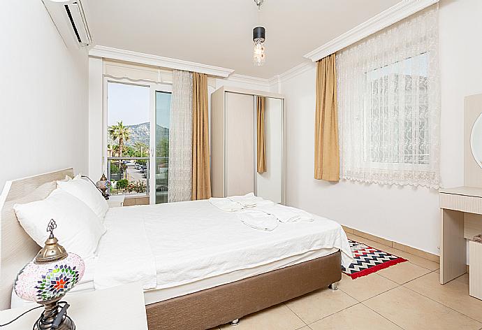 Double bedroom with en suite bathroom, A/C, and balcony access . - Villa Canberk . (Photo Gallery) }}