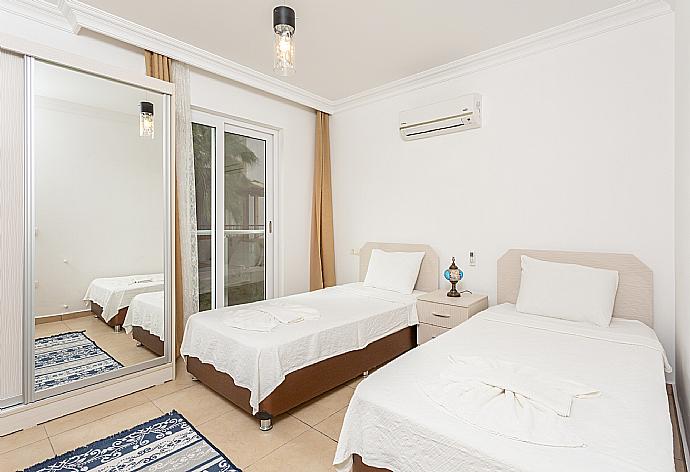 Twin bedroom with A/C . - Villa Canberk . (Photo Gallery) }}