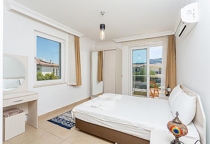 Double bedroom with en suite bathroom, A/C, and balcony access . - Villa Gunsu . (Photo Gallery) }}