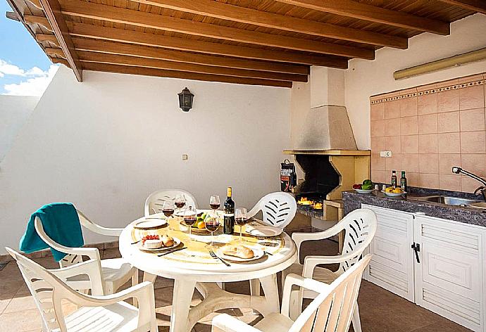 Terrace area with BBQ  . - Villa Ramos Dos . (Photo Gallery) }}