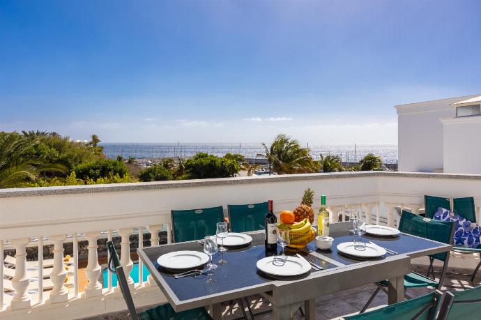 Upper terrace area with sea views . - Villa Ramos Uno . (Photo Gallery) }}