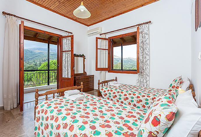 Twin bedroom with A/C and terrace access . - Cochelli Villa Upper . (Photo Gallery) }}