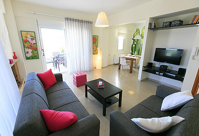 Living room with WiFi, TV, DVD player and terrace access . - Villa Lilium . (Photo Gallery) }}
