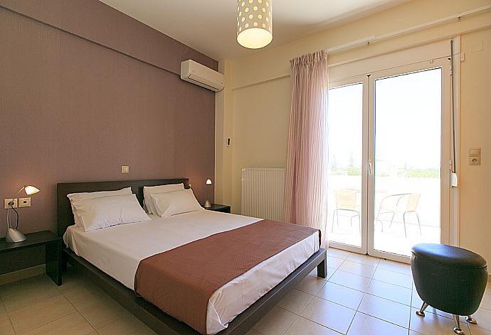 Double bedroom with A/C and balcony access . - Villa Lilium . (Photo Gallery) }}