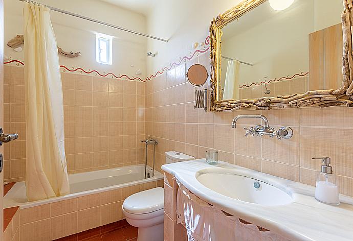 En suite bathroom with bath and shower . - Villa Almira . (Photo Gallery) }}