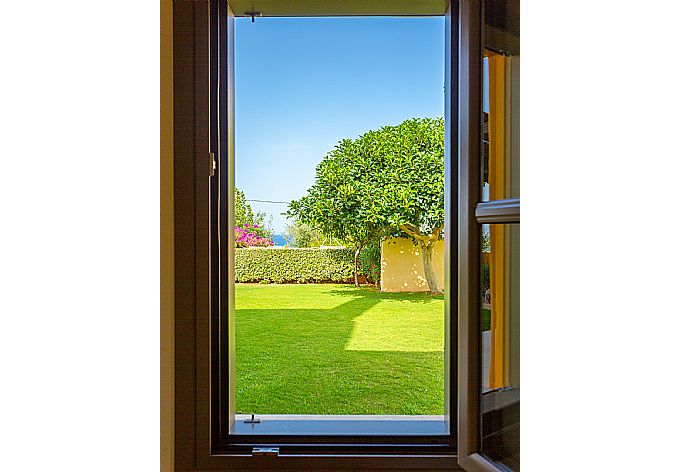 View of garden from bedroom window . - Villa Liakada . (Photo Gallery) }}