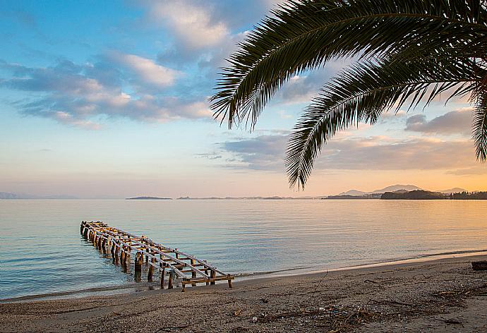 A tranquil sunset at Ipsos . - Villa Spyros . (Photo Gallery) }}