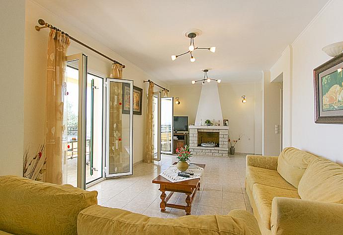 Living room with WiFi, satellite TV, DVD player and terrace access . - Villa Spyros . (Photo Gallery) }}