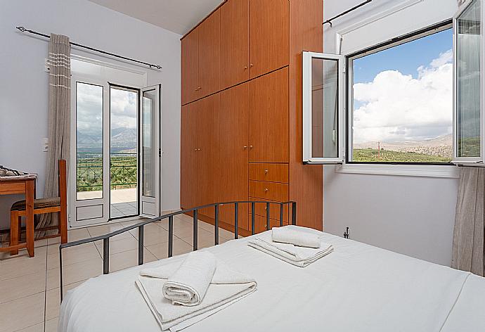 Double bedroom with A/C and balcony access . - Villa Giannis . (Galleria fotografica) }}