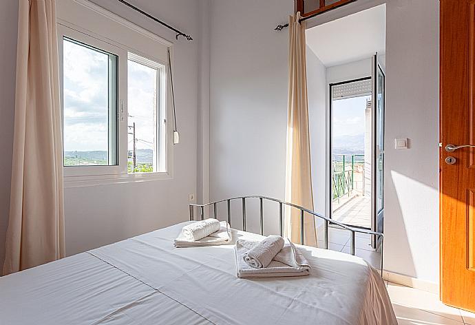 Double bedroom with A/C and balcony access . - Villa Giannis . (Galleria fotografica) }}