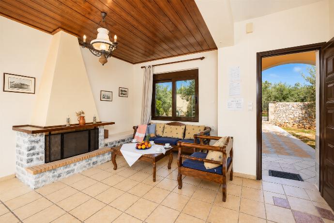 Living room with sofa, ornamental fireplace, WiFi internet, and satellite TV . - Ekklisies Tria . (Photo Gallery) }}