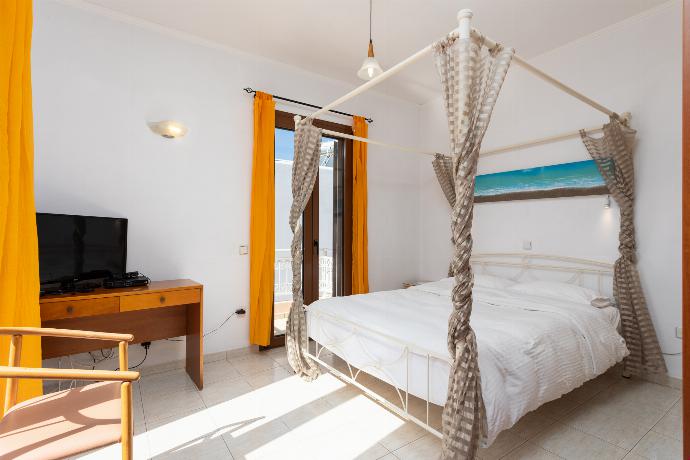 Double bedroom with A/C . - Villa Kassos . (Photo Gallery) }}