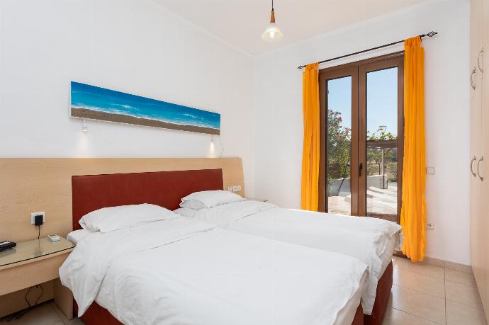 Twin bedroom with A/C . - Villa Kassos . (Photo Gallery) }}