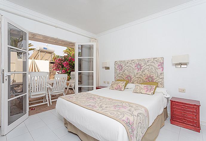 Double bedroom with terrace access . - Villa Estrellas . (Photo Gallery) }}