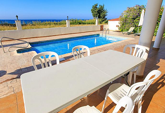 Sheltered terrace area . - Achilles Beach Villa Thio . (Photo Gallery) }}