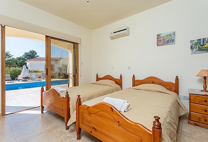 Twin bedroom with en suite bathroom, A/C, and terrace access . - Hector Beach Villa . (Photo Gallery) }}