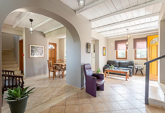 Open-plan living room with sofas, dining area, kitchen, WiFi internet, satellite TV, DVD player, and terrace access . - Villa Neria . (Galleria fotografica) }}